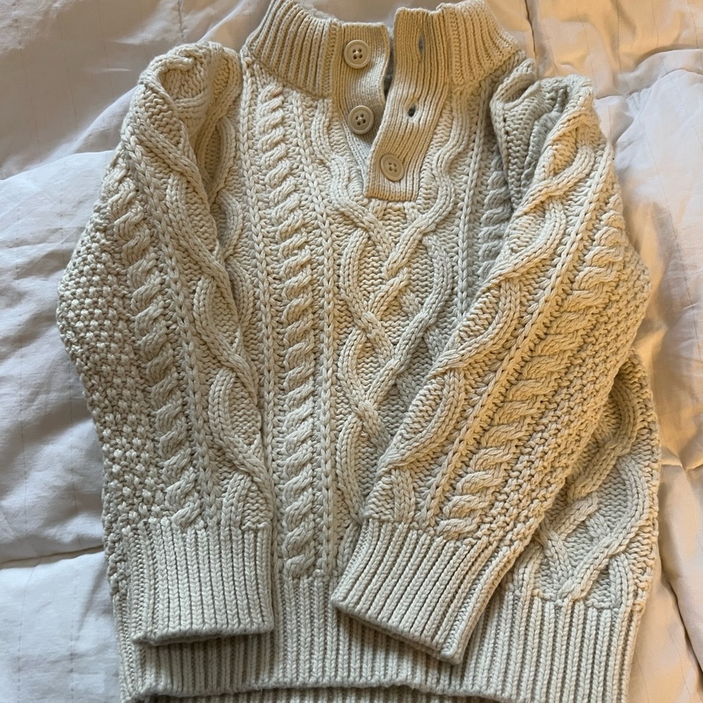 Cable knit sweater.